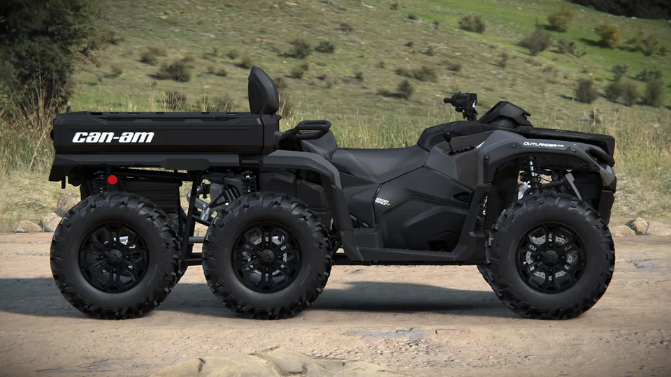 Can-Am Outlander MAX 6x6 2027 серого цвета сбоку: два места и грузовой кузов над задними колёсами