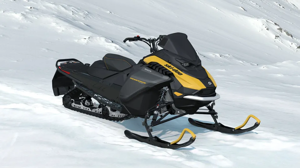 Ski-Doo Renegade Sport 2027 в цвете Neo Yellow на снегу, вид спереди справа